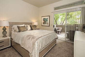 Autumn Oaks Model Bedroom With Access To Patio
